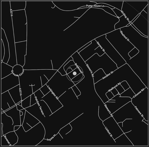 A grayscale map highlights a central roundabout at Seventh Circus, with various streets like Lexington Rd, Barnesmead Rd, and Colonial Rd branching out. Buildings are marked along the streets, including a luxury London florist on Pump House Ln. The map includes street names and layout details.